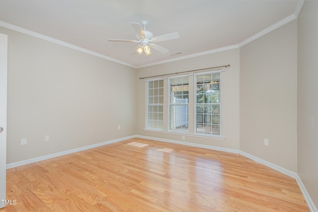 unfurnished room with visible vents, baseboards, a ceiling fan, light wood-style flooring, and ornamental molding