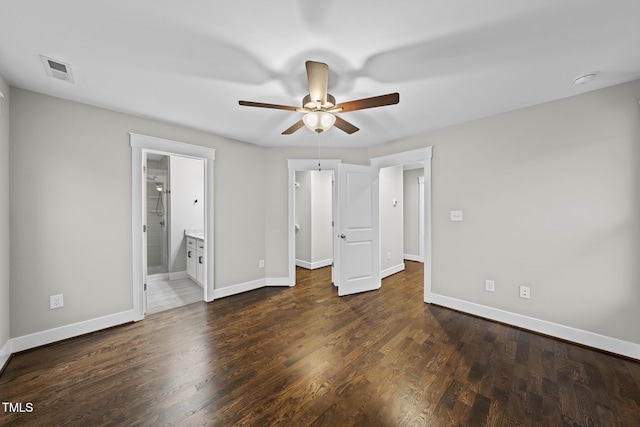 unfurnished bedroom featuring baseboards, visible vents, and wood finished floors