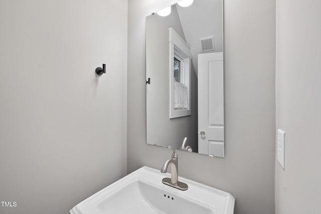 bathroom with a sink and visible vents