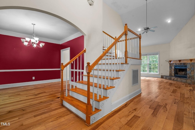 staircase featuring baseboards, visible vents, and hardwood / wood-style floors