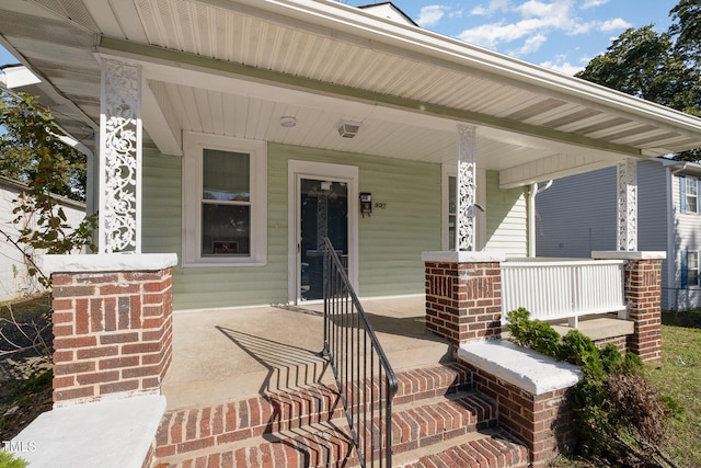 doorway to property with covered porch