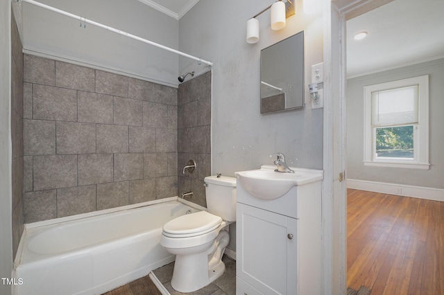 bathroom with crown molding, shower / bath combination, toilet, vanity, and wood finished floors