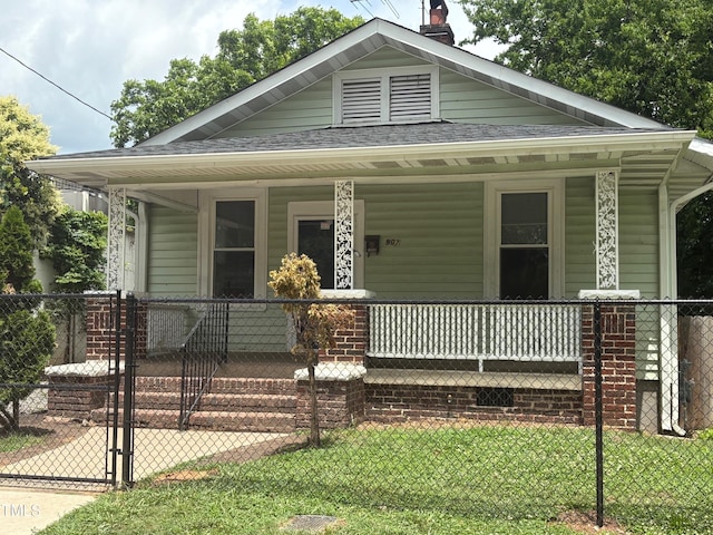 907 Holloway St, Durham, NC 27701 - bungalow-style home featuring covered porch, a shingled roof, and a chimney