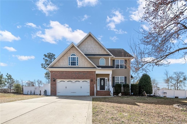 view of front of home featuring driveway, a garage, fence, and brick siding