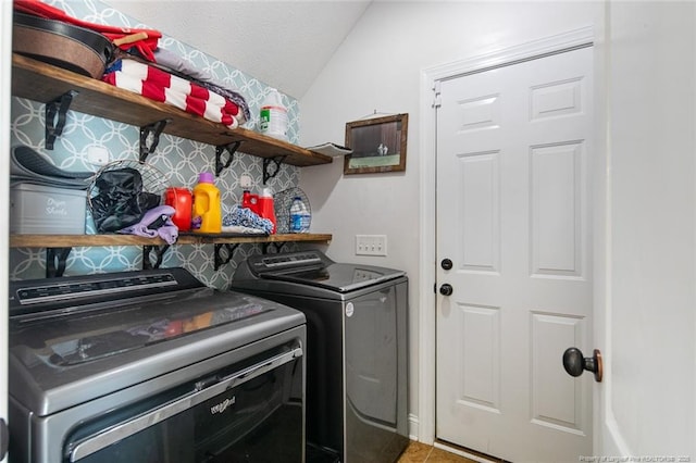 washroom featuring laundry area and washer and dryer