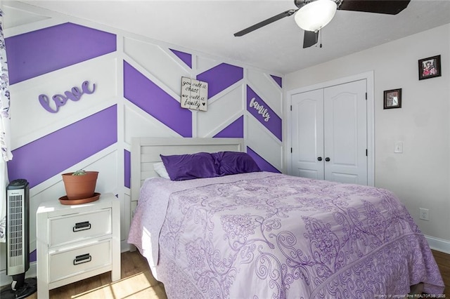 bedroom with a closet, ceiling fan, and wood finished floors