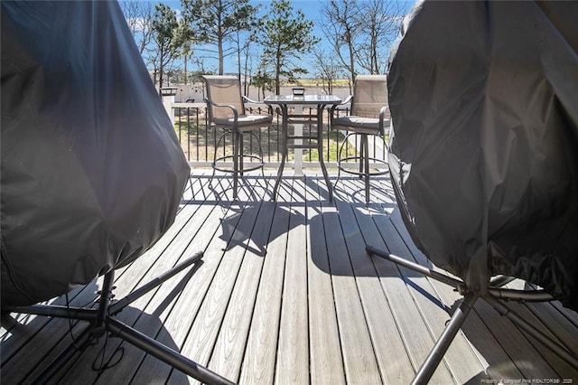 deck featuring outdoor dining area