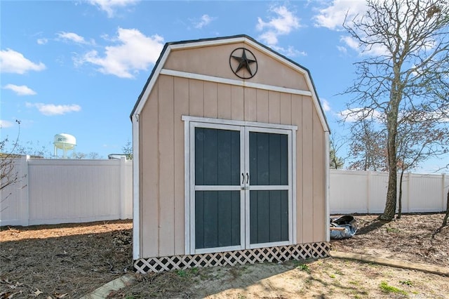 view of shed with a fenced backyard