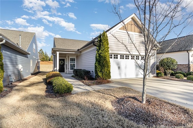 view of front of property with concrete driveway and an attached garage