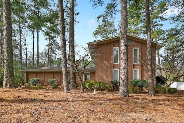 view of front of house featuring brick siding