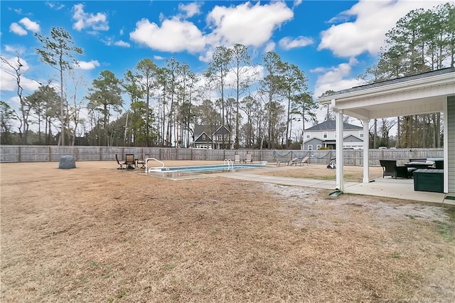 view of yard featuring a fenced in pool, a patio area, and fence