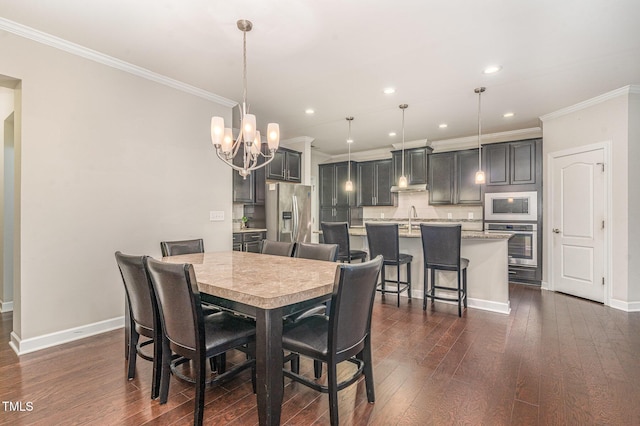 dining room featuring ornamental molding, recessed lighting, dark wood finished floors, and baseboards