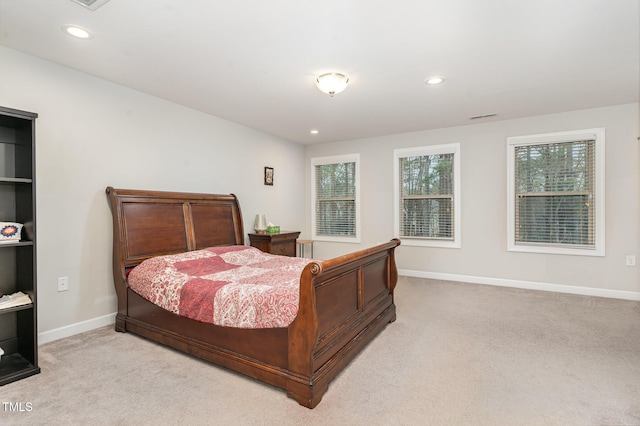 bedroom featuring recessed lighting, baseboards, and light colored carpet