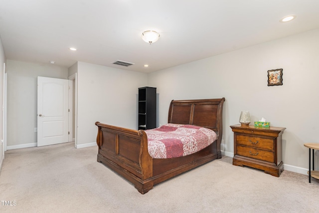 carpeted bedroom with recessed lighting, visible vents, and baseboards