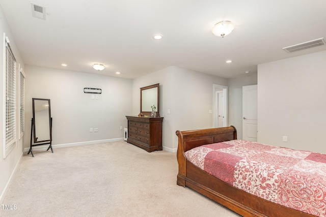 bedroom featuring recessed lighting, visible vents, light carpet, and baseboards