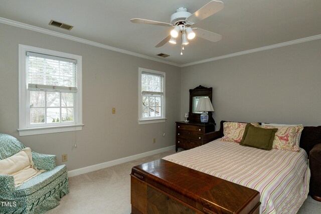 bedroom with carpet flooring, baseboards, visible vents, and ornamental molding