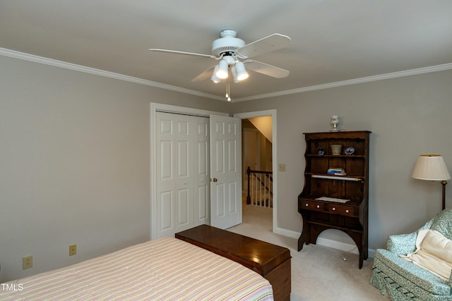 bedroom with baseboards, ceiling fan, ornamental molding, a closet, and light carpet