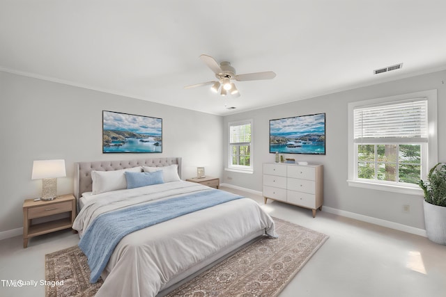 bedroom featuring baseboards, ornamental molding, visible vents, and a ceiling fan