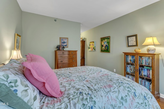 bedroom with wood finished floors