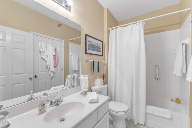 full bath featuring shower / bath combo with shower curtain, vanity, and toilet