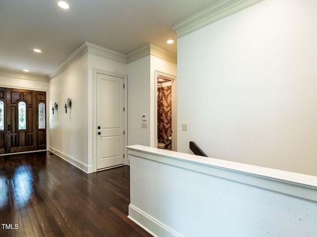 foyer entrance with dark wood-style flooring, crown molding, recessed lighting, and baseboards
