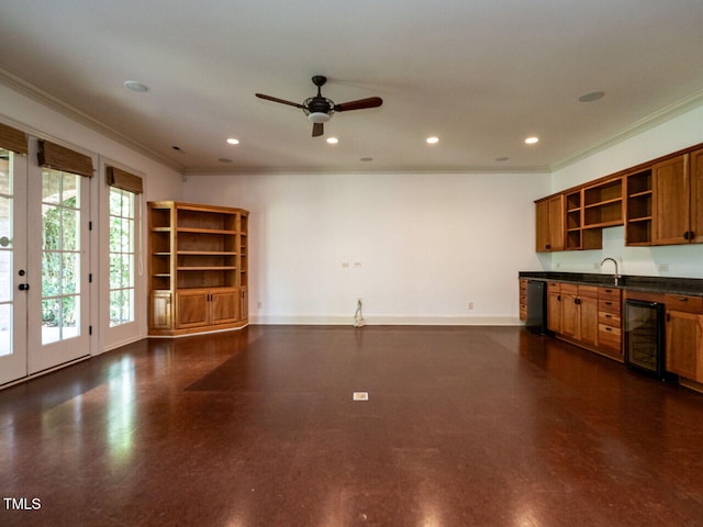 unfurnished living room featuring beverage cooler, ornamental molding, a ceiling fan, recessed lighting, and baseboards