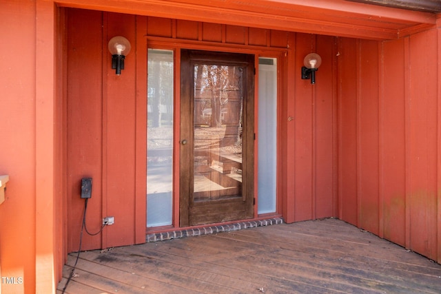 entrance to property featuring board and batten siding