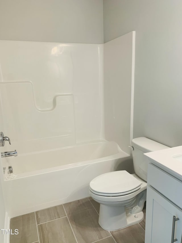 full bathroom with shower / tub combination, vanity, and toilet