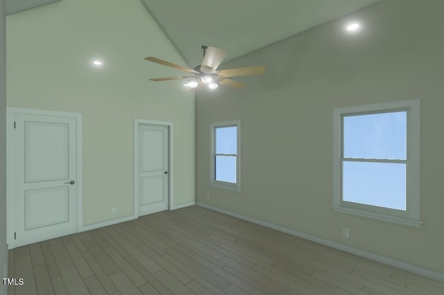 spare room with a ceiling fan, wood finished floors, and baseboards