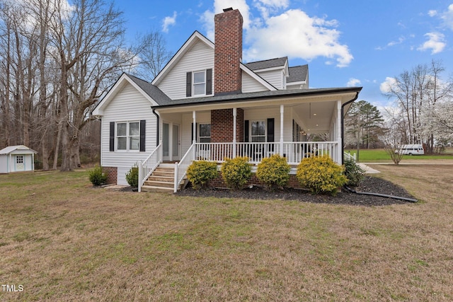 farmhouse inspired home with a porch, a chimney, a front lawn, and roof with shingles