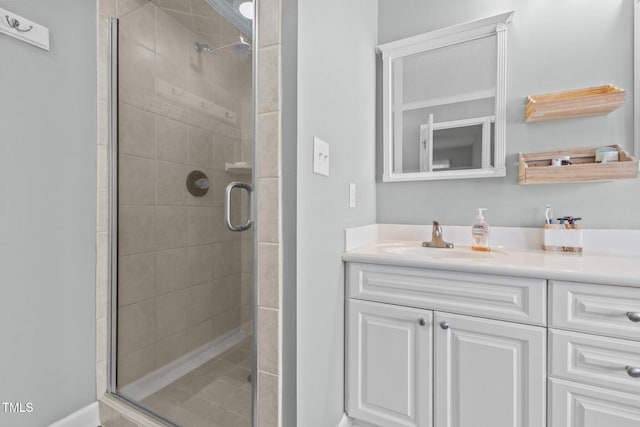 full bathroom featuring vanity and a shower stall