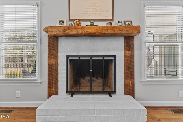 details with visible vents, baseboards, and wood finished floors