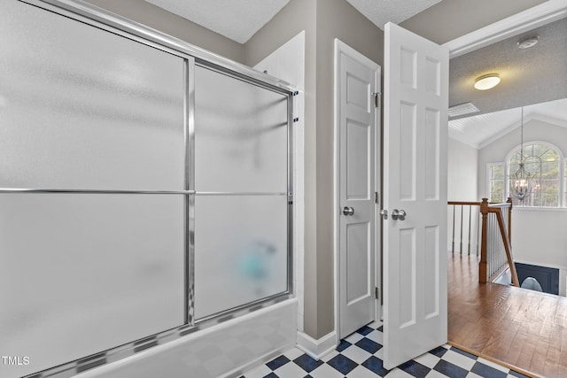 full bathroom featuring tile patterned floors, enclosed tub / shower combo, lofted ceiling, and a chandelier