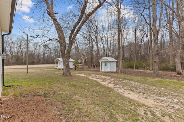 view of yard with an outbuilding and a storage shed