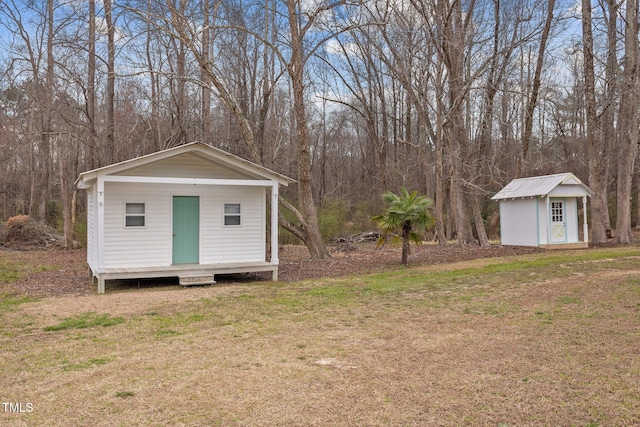 view of shed with a forest view