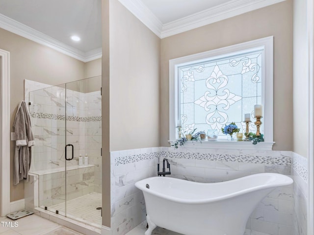 309 Shoreline Dr, Princeton, NC 27569 - full bathroom featuring a wainscoted wall, ornamental molding, a stall shower, a soaking tub, and tile walls