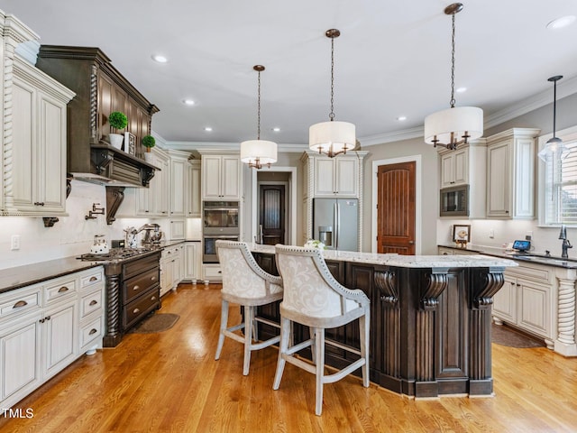 309 Shoreline Dr, Princeton, NC 27569 - kitchen featuring a kitchen breakfast bar, a center island, appliances with stainless steel finishes, crown molding, and light wood finished floors