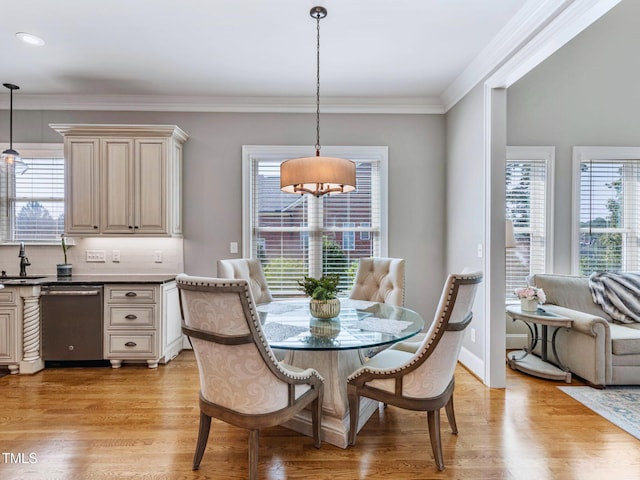 309 Shoreline Dr, Princeton, NC 27569 - dining room featuring light wood finished floors, crown molding, and a wealth of natural light