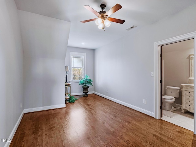 309 Shoreline Dr, Princeton, NC 27569 - unfurnished bedroom with wood finished floors, visible vents, and baseboards