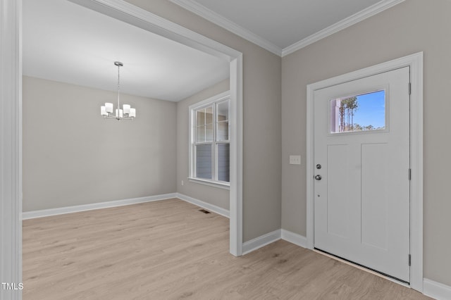 25 Arbor Dr, Youngsville, NC 27596 - foyer entrance featuring crown molding, light wood-type flooring, visible vents, a notable chandelier, and baseboards