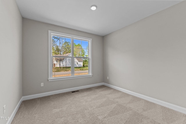 25 Arbor Dr, Youngsville, NC 27596 - spare room featuring carpet flooring, visible vents, and baseboards