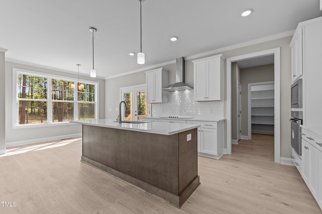 25 Arbor Dr, Youngsville, NC 27596 - kitchen with light countertops, crown molding, wall chimney range hood, and wall oven