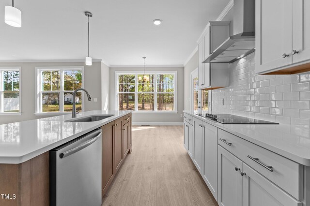 25 Arbor Dr, Youngsville, NC 27596 - kitchen with light wood-style floors, stainless steel dishwasher, wall chimney exhaust hood, a sink, and black electric stovetop