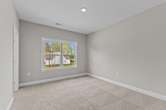 25 Arbor Dr, Youngsville, NC 27596 - spare room featuring visible vents, baseboards, and light colored carpet