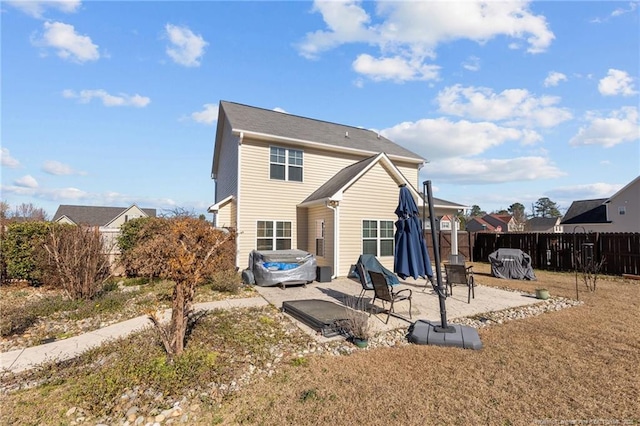 back of house featuring a patio area and fence