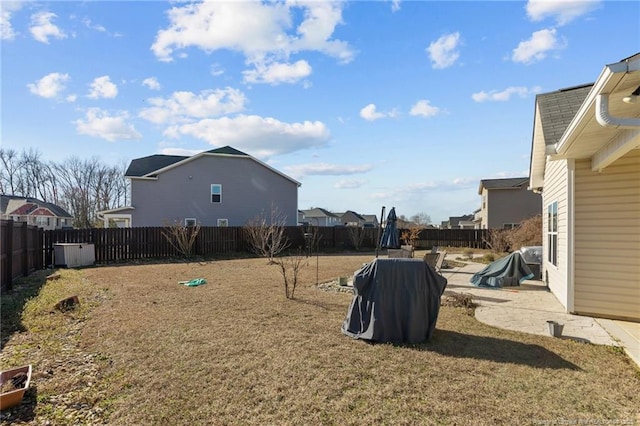 view of yard featuring a patio area and a fenced backyard