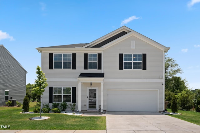 view of front of house with a garage, concrete driveway, and a front lawn