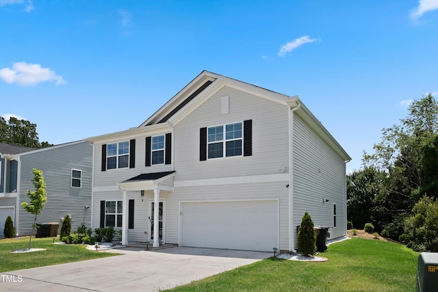 view of front facade featuring a garage, a front yard, and driveway