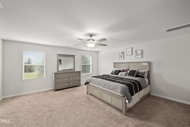 bedroom featuring carpet, visible vents, and baseboards