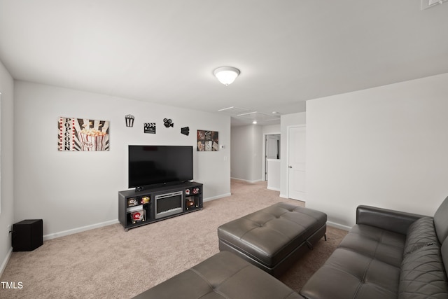 carpeted living room featuring baseboards